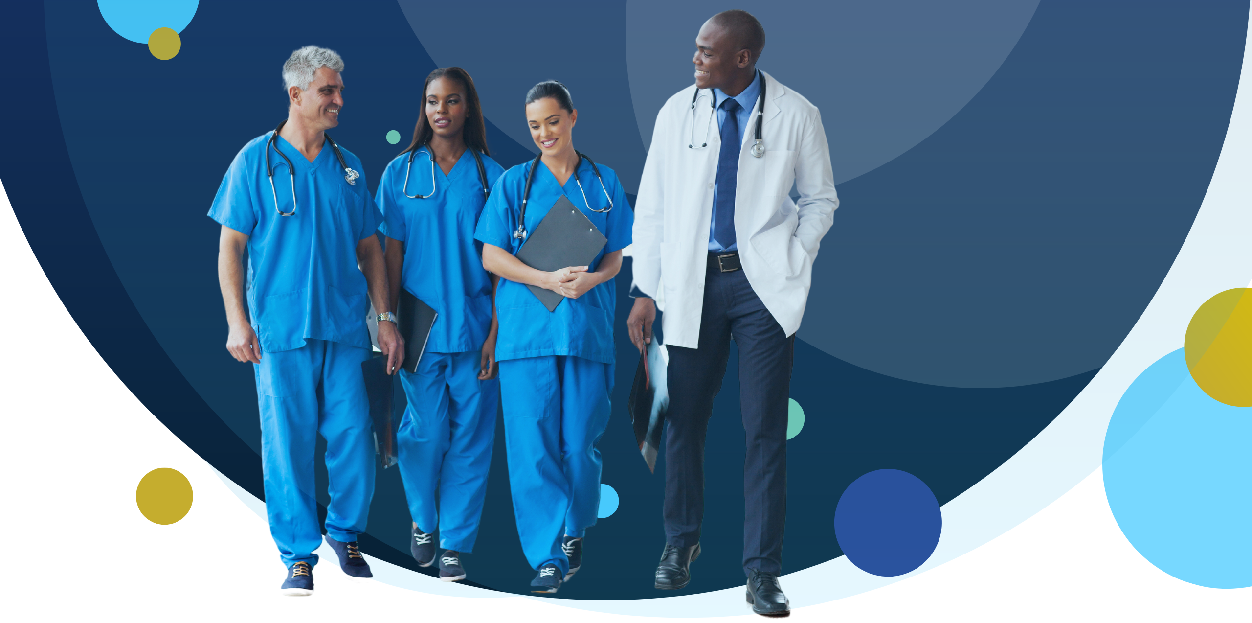 Group of diverse healthcare professionals walking together in scrubs and a lab coat, symbolizing collaboration and wellbeing in a hospital setting.